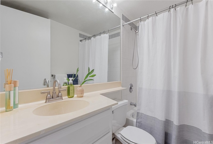 Primary bath, with bathtub. Full size washer & dryer in master bathroom