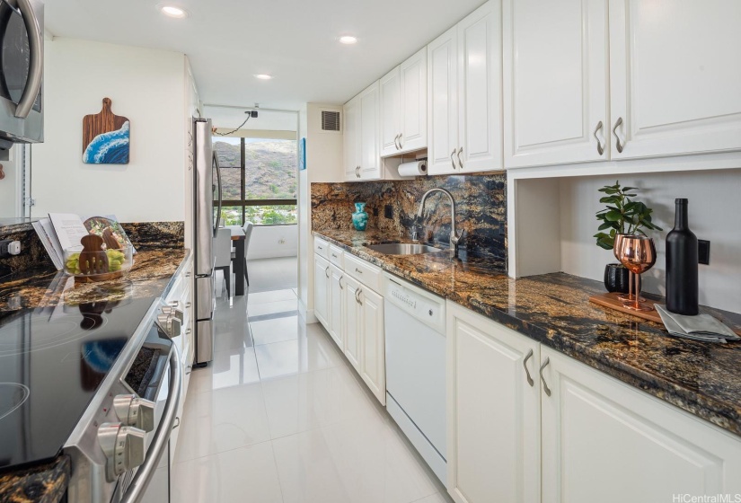 The kitchen has a lot of cabinets and countertops for your small appliances and meal preps.