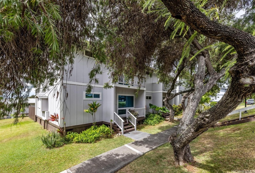 Corner end unit with a lovely tree to shade the entry!