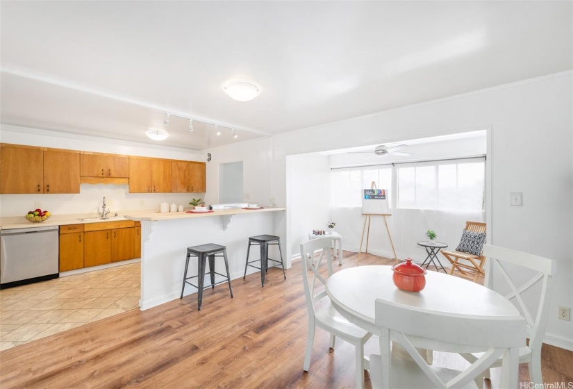 Dining area to kitchen and enclosed lanai