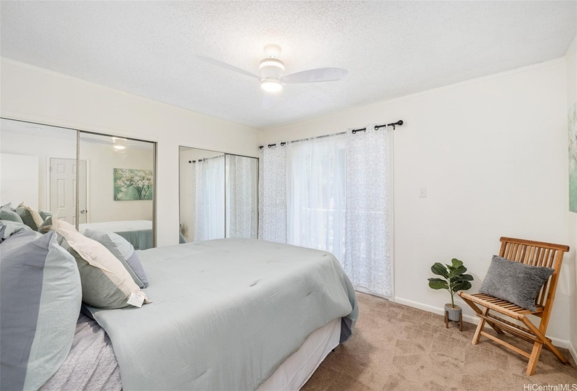 Primary bedroom upstairs with upgraded vinyl window and sliding glass door