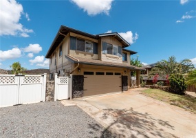 In addition to the two-car garage, the driveway offers an ample space for two more cars.