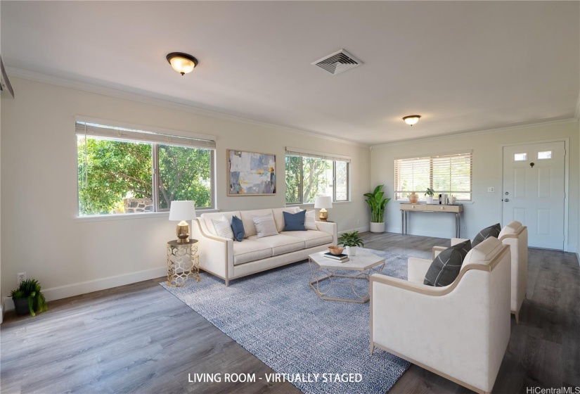 Spacious living room with luxury vinyl plank flooring.