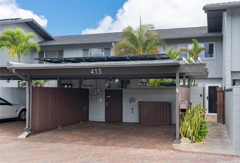 Two car carport.  Gate to the left accesses the laundry/mud/storage area.  Gate to the right accesses front courtyard.