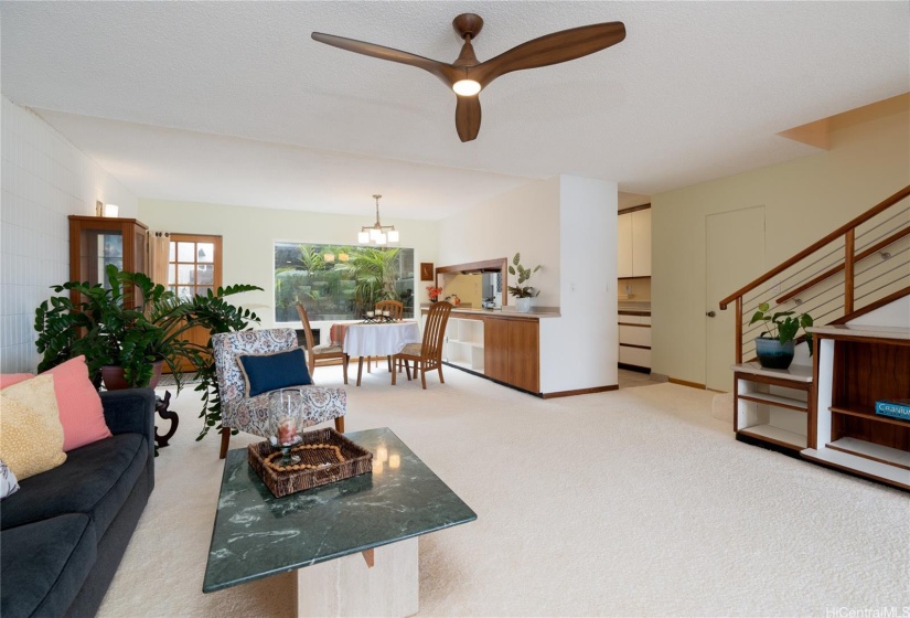 Front door on far left, window by dining table looks to private, fully enclosed and landscaped entry courtyard.