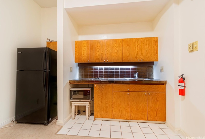 Second entrance behind refrigerator