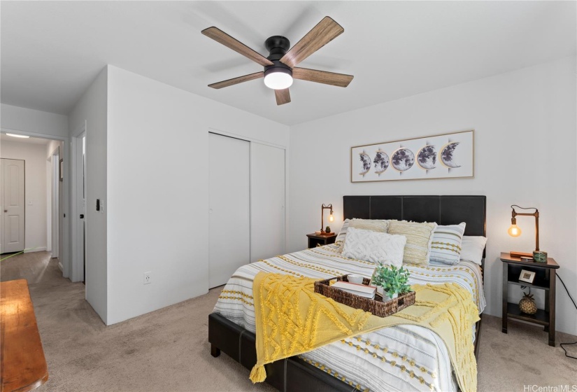 Primary bedroom with two closets and ensuite bathroom