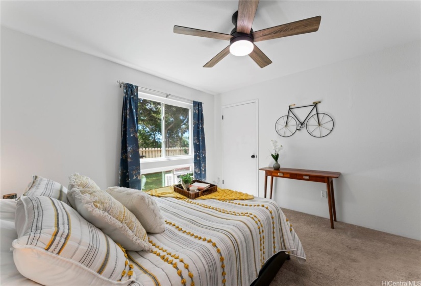 Primary bedroom with two closets and ensuite bathroom