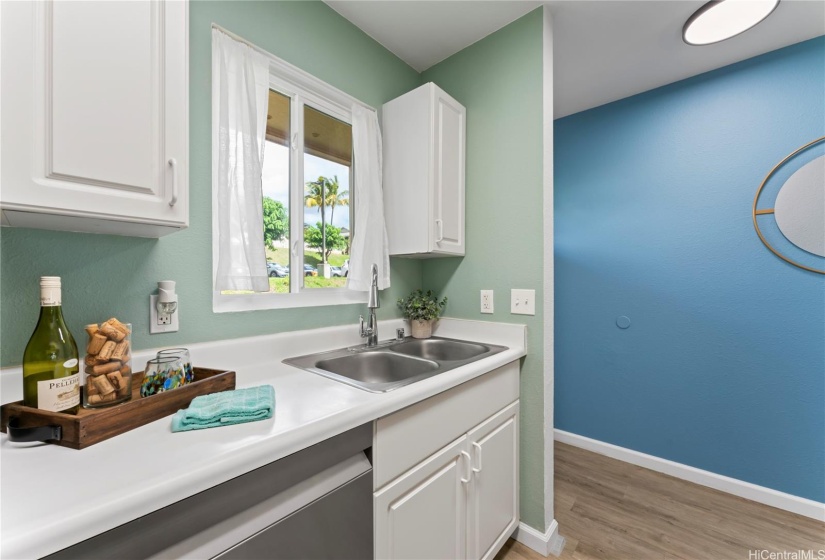 Kitchen with new dishwasher, refrigerator, glass top stove, and microwave