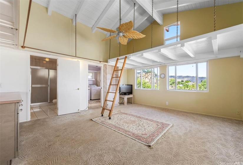 Great room off of the kitchen, with full bath and laundry room.