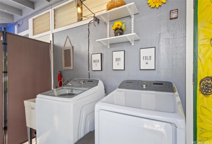 New Samsung washer dryer and laundry area.