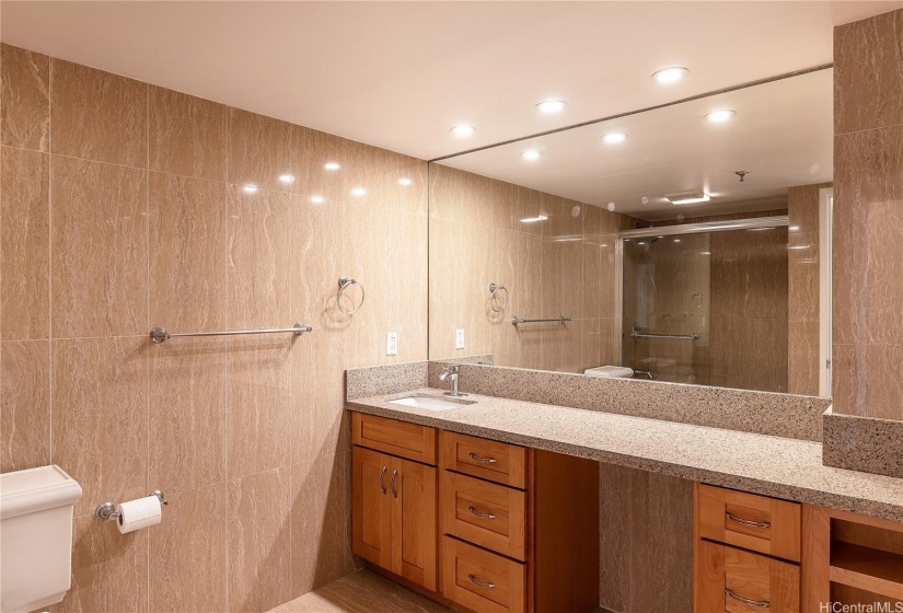 Th spacious primary bathroom is like an in-home spa!