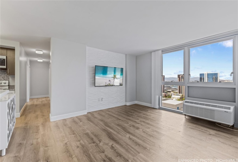 Living Room and Hall area with West / Ewa facing view across the Kakaako district. Enhanced.