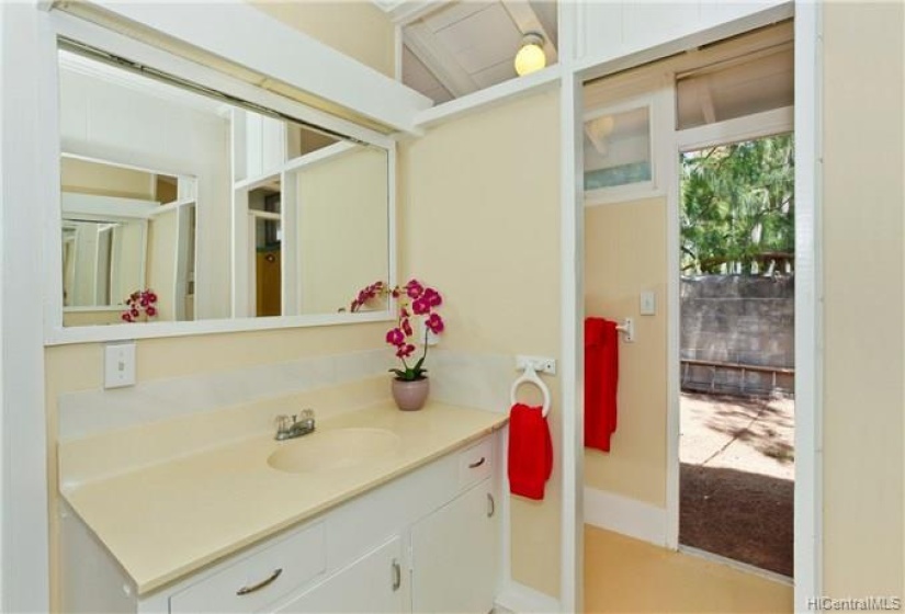 Island style second bathroom, situated between the second and third bedrooms, has access from the outside.