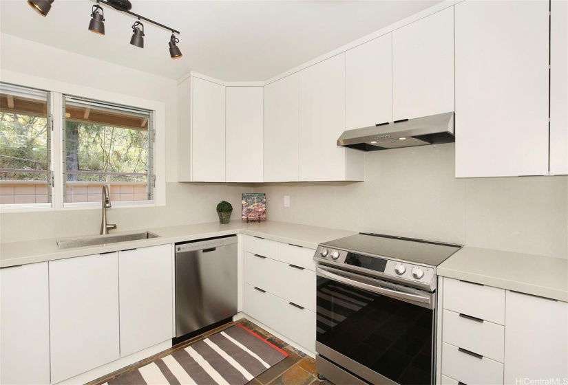 Upgraded kitchen & appliances with lots of lots of storage.