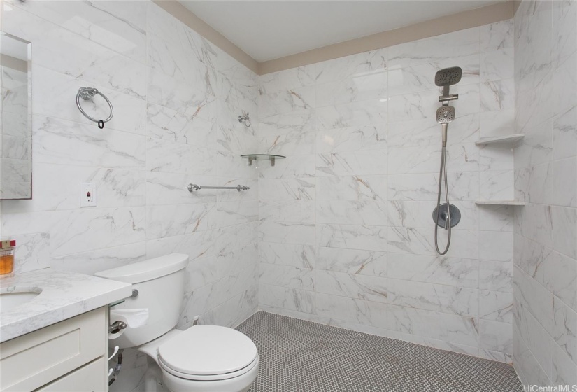 Spacious bathroom adjacent laundry room