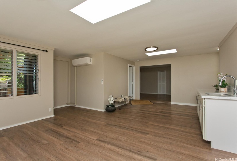 Skylights provide natural soft light, making the living room feel more spacious.