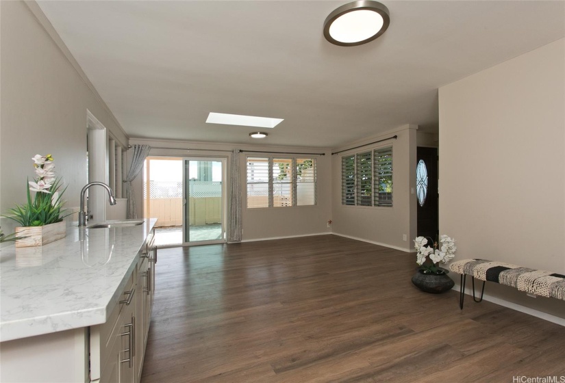 Spacious living room with wet bar is easy-going spot for relaxing, dining and entertaining.