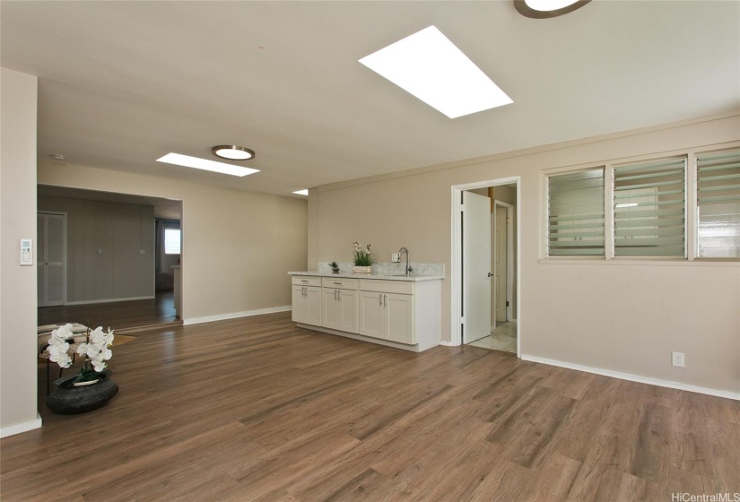 Another angle of the living room with wet bar