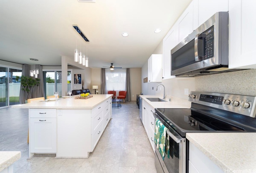 Large kitchen with island and lots of cabinets.