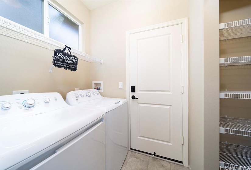 laundry room with large pantry across