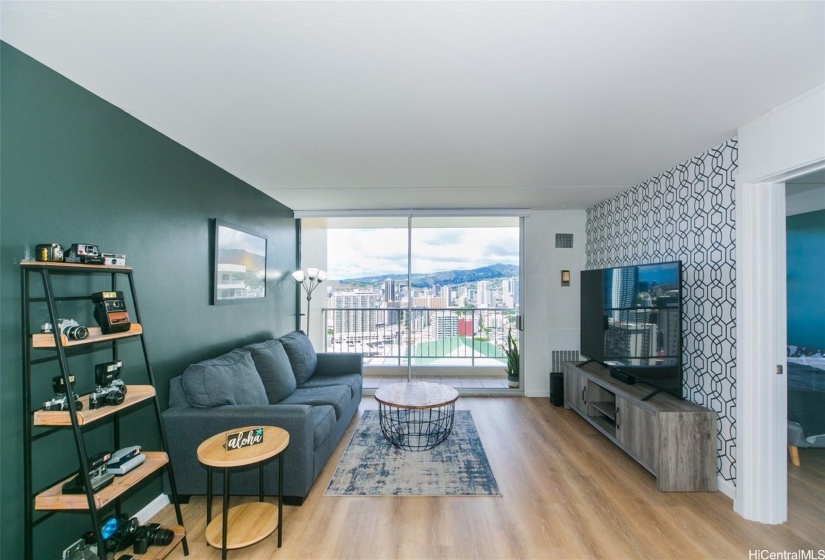 Living room overlooking lanai and city/canal view