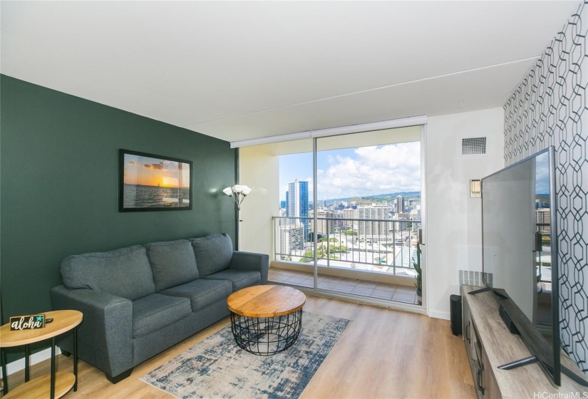 Living room overlooking lanai and city/canal view