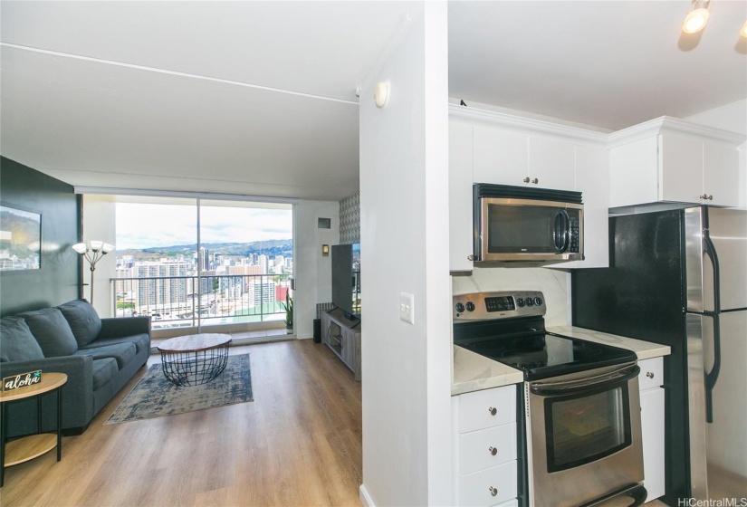 Kitchen with stone countertops and newer appliances