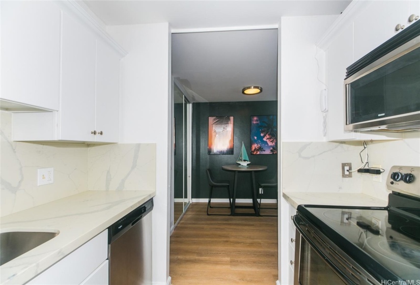 Kitchen with stone countertops and newer appliances