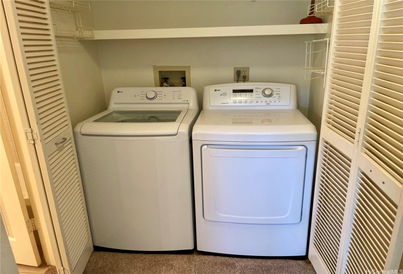 The washer and dryer are located in the bedroom