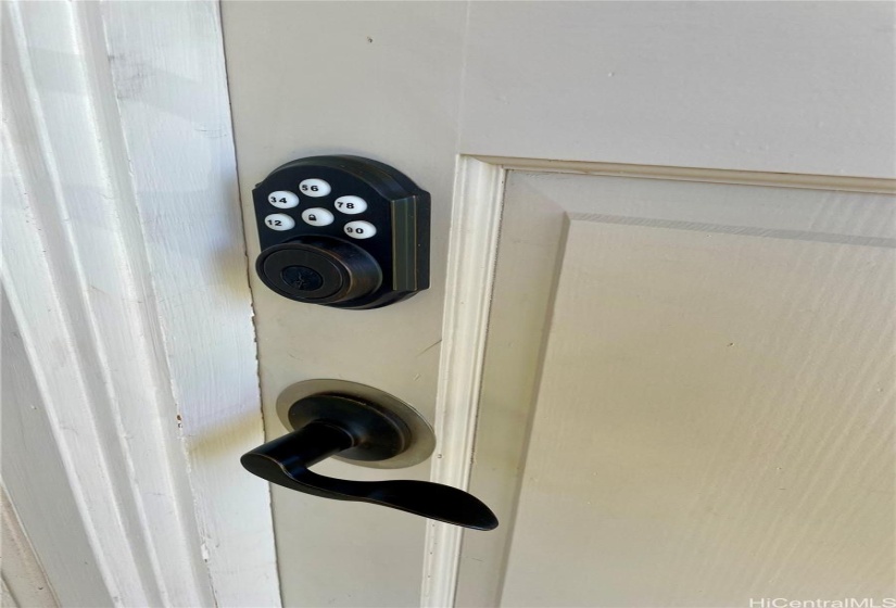 The front door features a push-button lock.