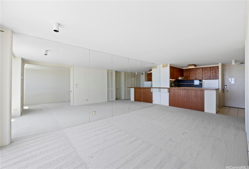 Stylish striking mirror wall that adds a touch of elegance and enhances the sense of space.