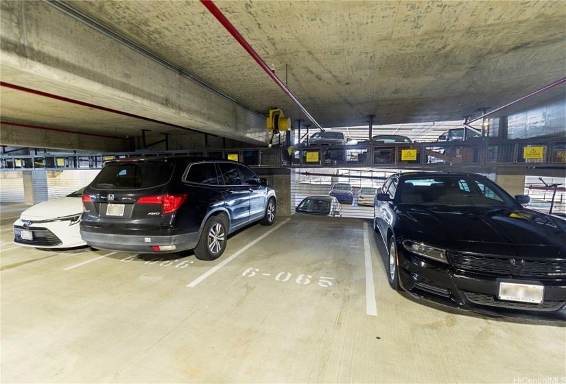 Parking stall 6-065 and dedicated 240 outlet overhead for EV charging