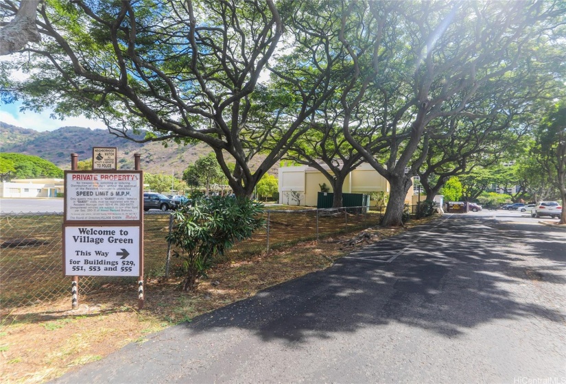 Entrance to the 2nd parking lot on the valley side of the Village Green Townhomes next to Hahaione Elementary School