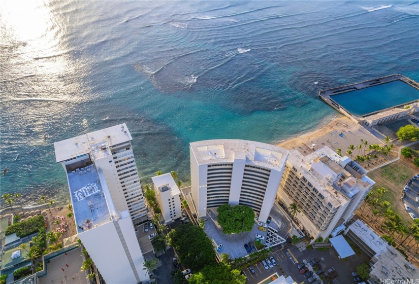 Sans Souci is the ICONIC Gem of the Gold Coast! Rich in Hawai'i History and Realized as the Building Built on the Beach that is prevented by Subsequent Zoning Laws. Envision Owning this Paradise Escape!