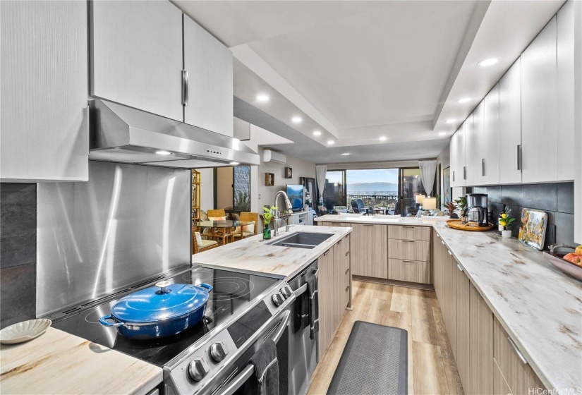 Recent updates include a spacious remodeled kitchen with newer appliances, luxury vinyl plank flooring, and fresh paint.