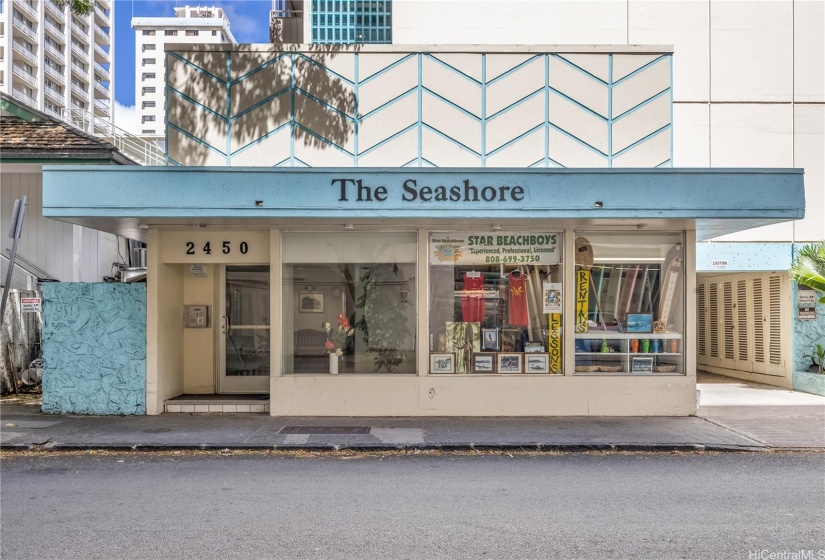 Front entry to the Seashore lobby and a handy beachboy stand in the building front