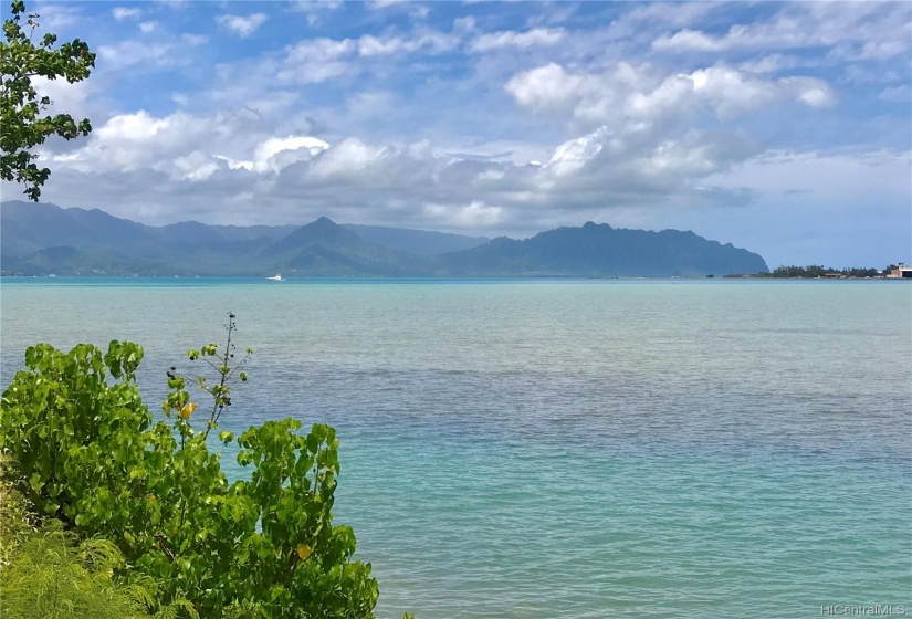 View of Kaneohe Bay from the land along the entrance to the shallow draft harbor.