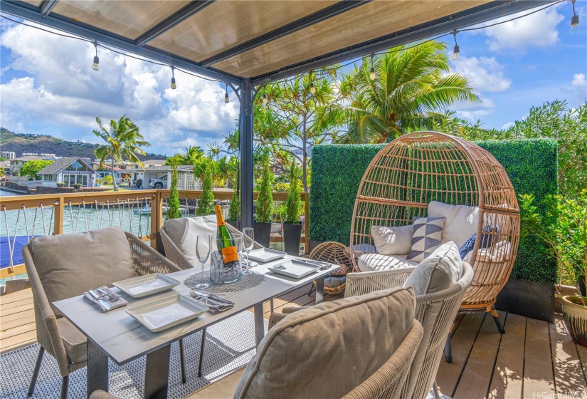 Back ocean side deck area with covered pergola.