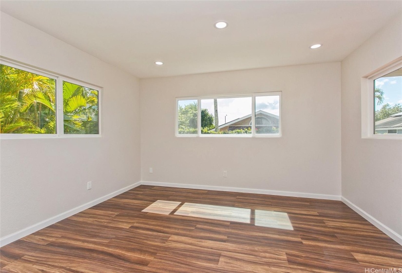 Downstairs bonus room that could be used as a family room or office with side door that leads to