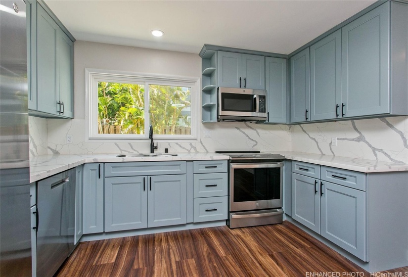 Enhanced - Completely renovated kitchen with all new stainless steel appliances