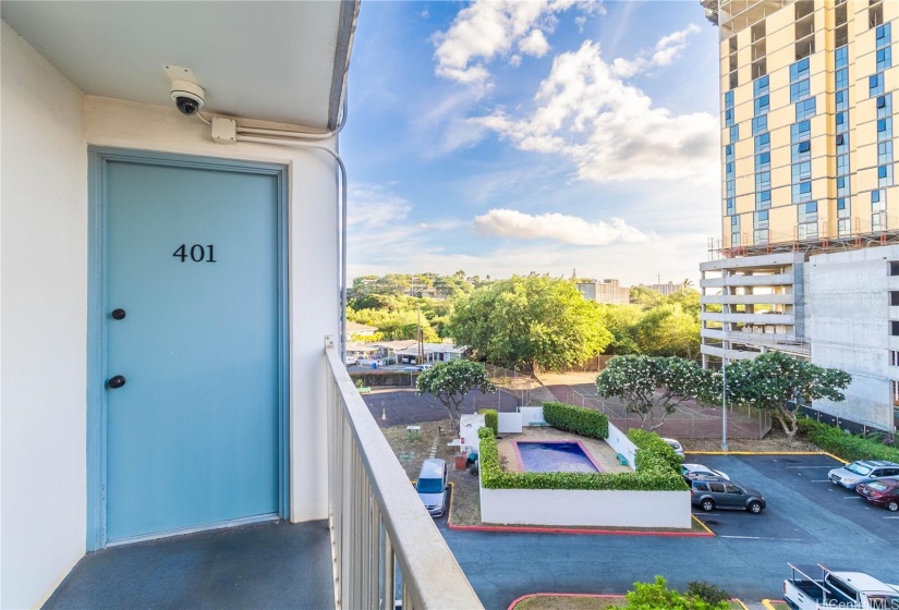 Corner unit, with view of the amenities and parking stall.