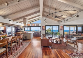 Vaulted high ceiling with open beams, well designed lighting fixtures