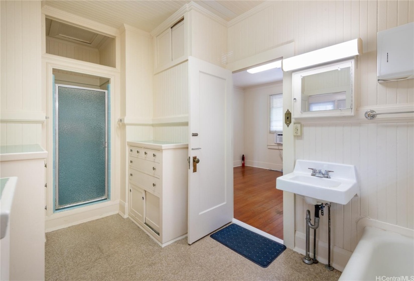 Primary bathroom shower and built-in drawers