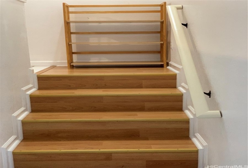 Between two bedroom and living room stairways