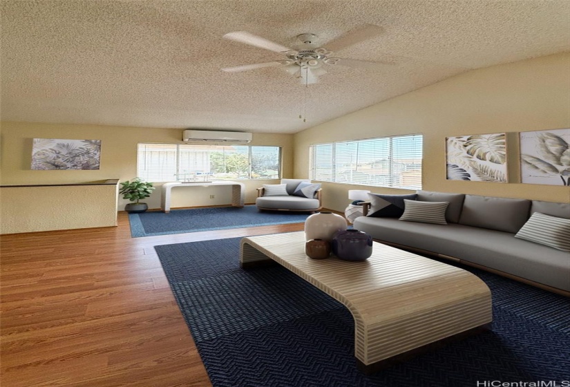 Living room facing the ocean view ! Partial ocean view with split a/ c ( virtually stage )