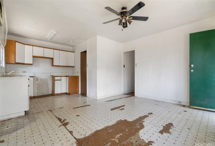 Original build kitchen/living area with true hard wood floors under tile