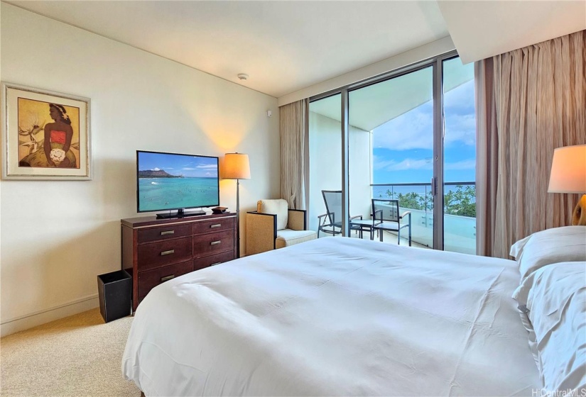 Bedroom with separate lanai to enjoy the gorgeous sunset and Friday Fireworks.