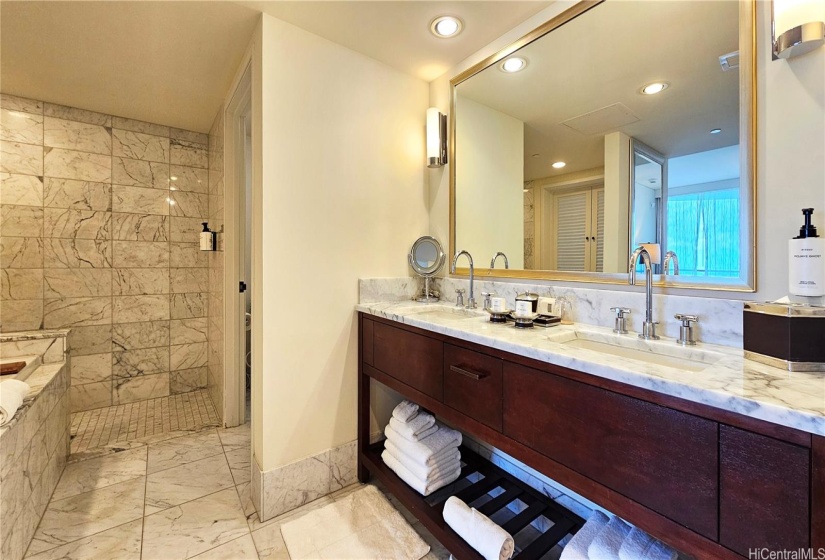 Large main bathroom with deep soaking tub and separate shower.