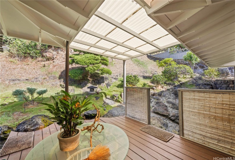 Back lanai accessible from the primary bedroom, guest bedroom and hallway.